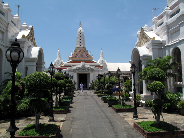 Center walkway of the temple, with the ordination hall and three towers behind.