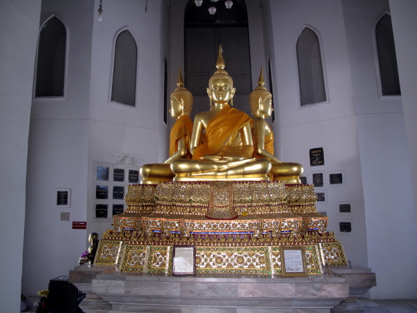 Four Buddha images within the main tower, facing each direction.