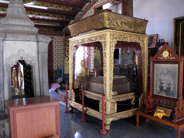 The sedan chair of King Rama III in the prayer hall fronting the Ordination hall.